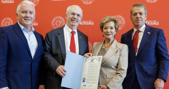 NU Regent Tim Clare, President Jeffrey P. Gold, M.D., U.S. Secretary of Education Linda McMahon and Nebraska Governor Jim Pillen with a proclamation recognizing joint accreditation between UNL and UNMC as a significant step forward for Nebraska. (Photo: Jordan Opp, UNL University Communication and Marketing)